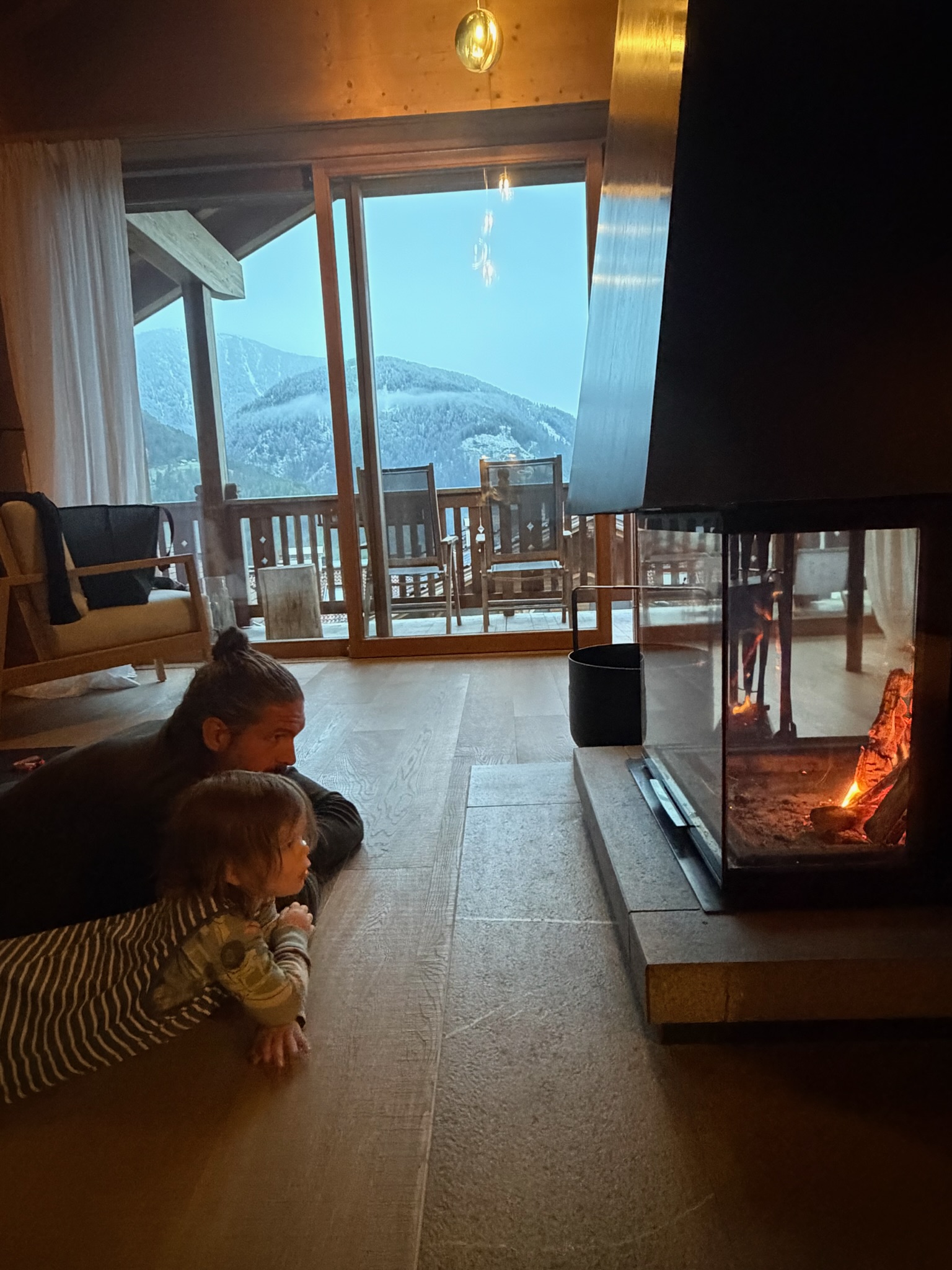 Kids club interior with wooden playhouse and slide